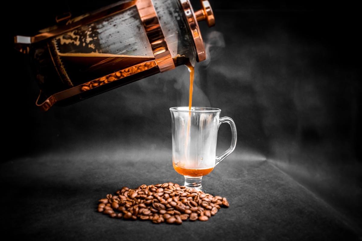 Make an espresso with a French Press. Shot of espresso in an elegant glass.