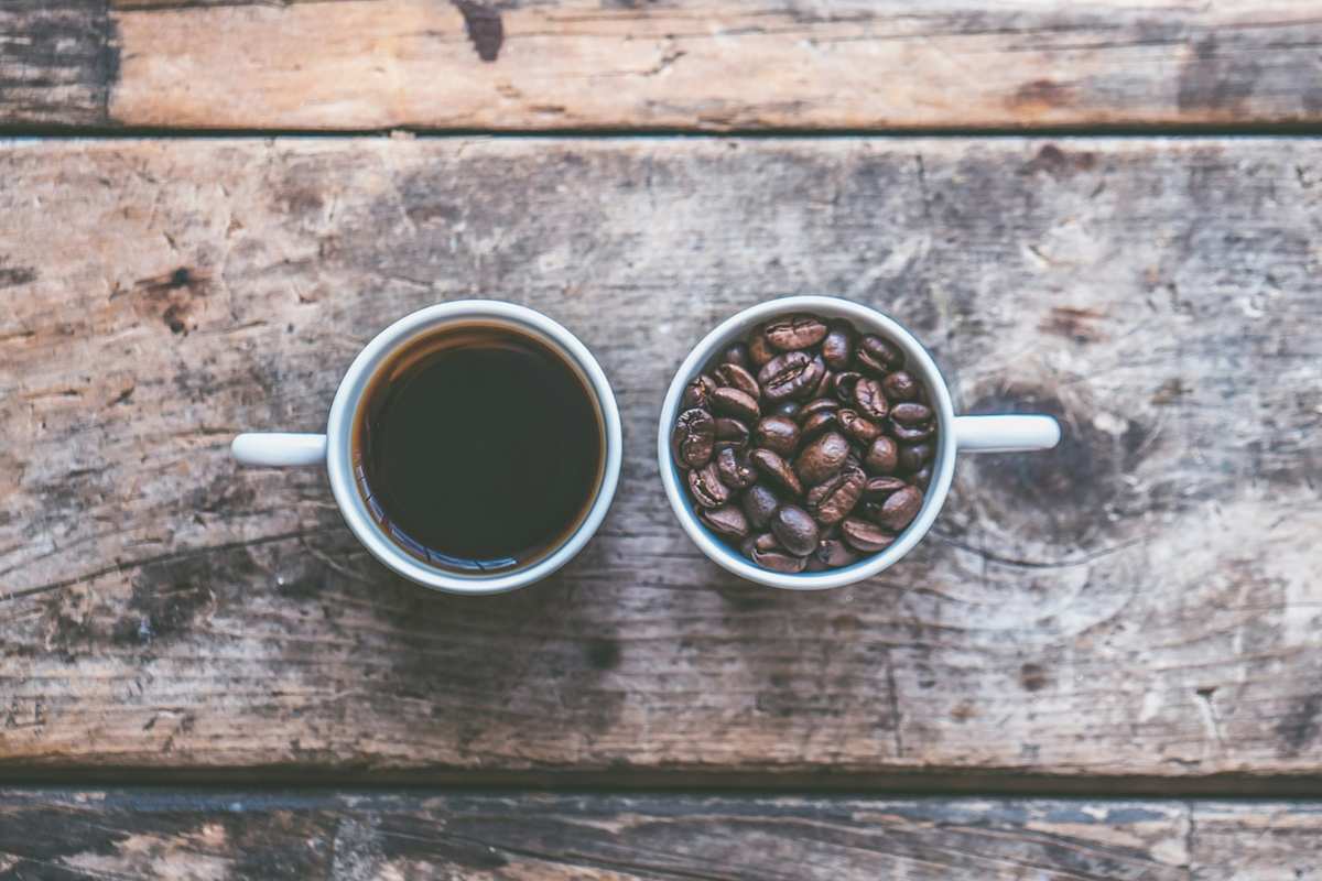 Two cups side by side — espresso and coffee. Photo by Jessica Lewis on Unsplash.