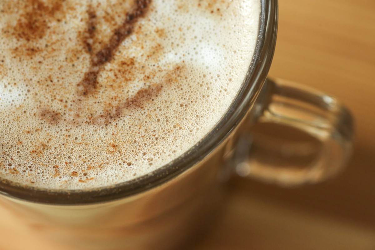 Frothed milk being poured to make cold foam at home
