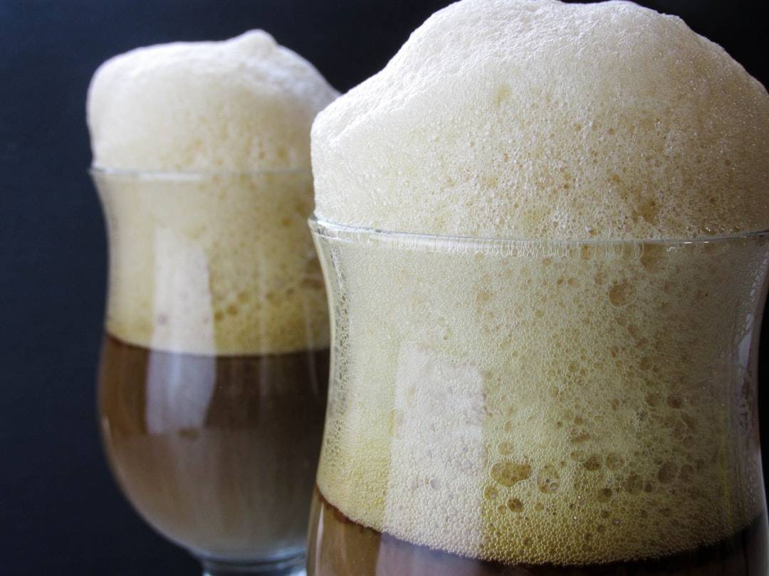 Two glasses of cold brew coffee side by side