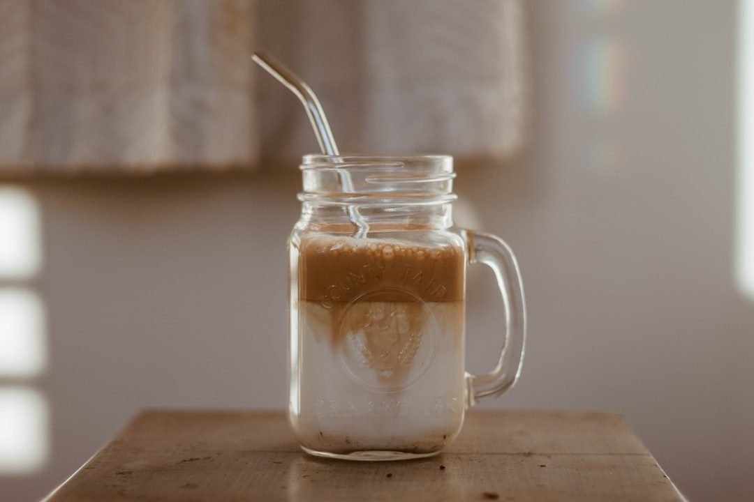 Dalgona coffee served in a glass mug